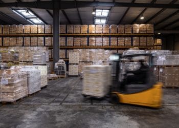 A forklift truck moves pallets stacked with wine inside a JF Hillebrand Group AG wine storage and transit logistics warehouse in Blanquefort, France, on Friday, Sept. 27, 2019. Photographer: Balint Porneczi/Bloomberg