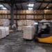 A forklift truck moves pallets stacked with wine inside a JF Hillebrand Group AG wine storage and transit logistics warehouse in Blanquefort, France, on Friday, Sept. 27, 2019. Photographer: Balint Porneczi/Bloomberg