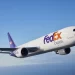 A FedEx plane flies through the air