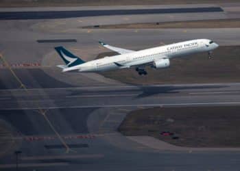 An aircraft operated by Cathay Pacific Airways Ltd. takes off from Hong Kong International Airport in Hong Kong, China, on Thursday, Jan. 6, 2022.