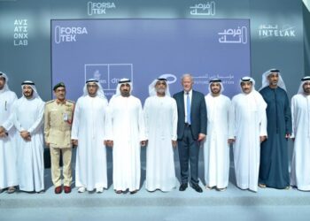 Several men stand together to launch a partnership in the United Arab Emirates.