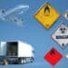 Dangerous goods signs sit alongside a plane and truck