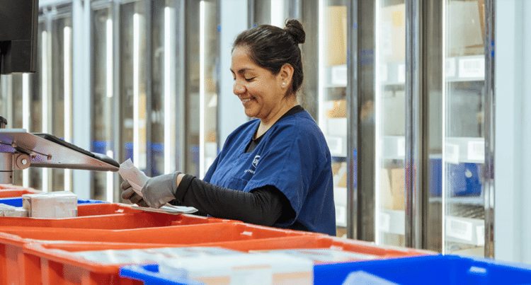 A UPS Healthcare employee works in pharma warehouse