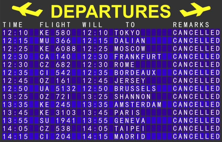 A departure board at an airport shows international flights canceled.