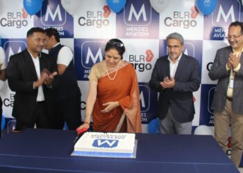 Representatives of Menzies Aviation and Bangalore International Airport Ltd. with a cake