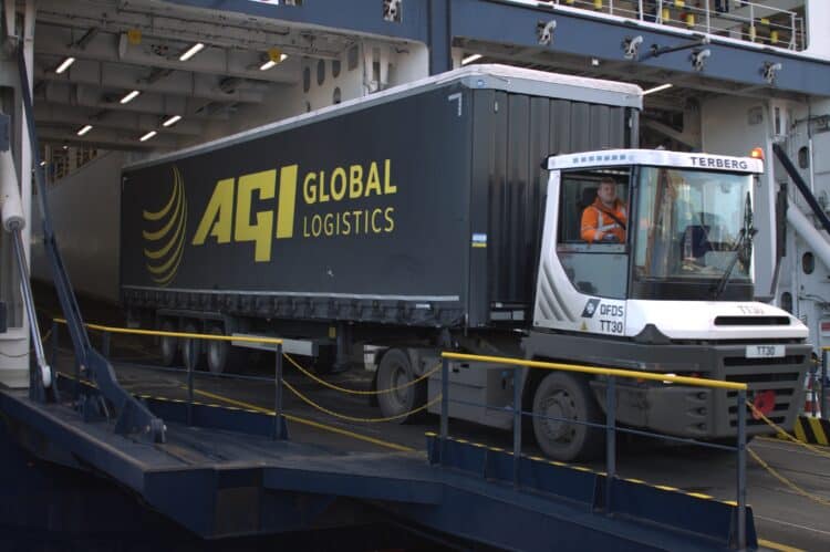 An AGI heavy-goods vehicle departs a warehouse