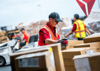 A Delta Cargo employee handles cargo