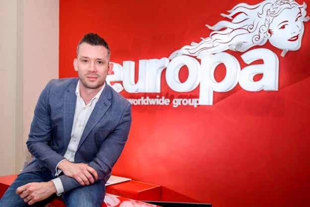 Miles O'Donnell in front of the Europa sign