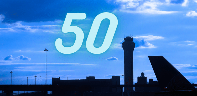 Number '50' over a blue sky with the silhouette of an airport