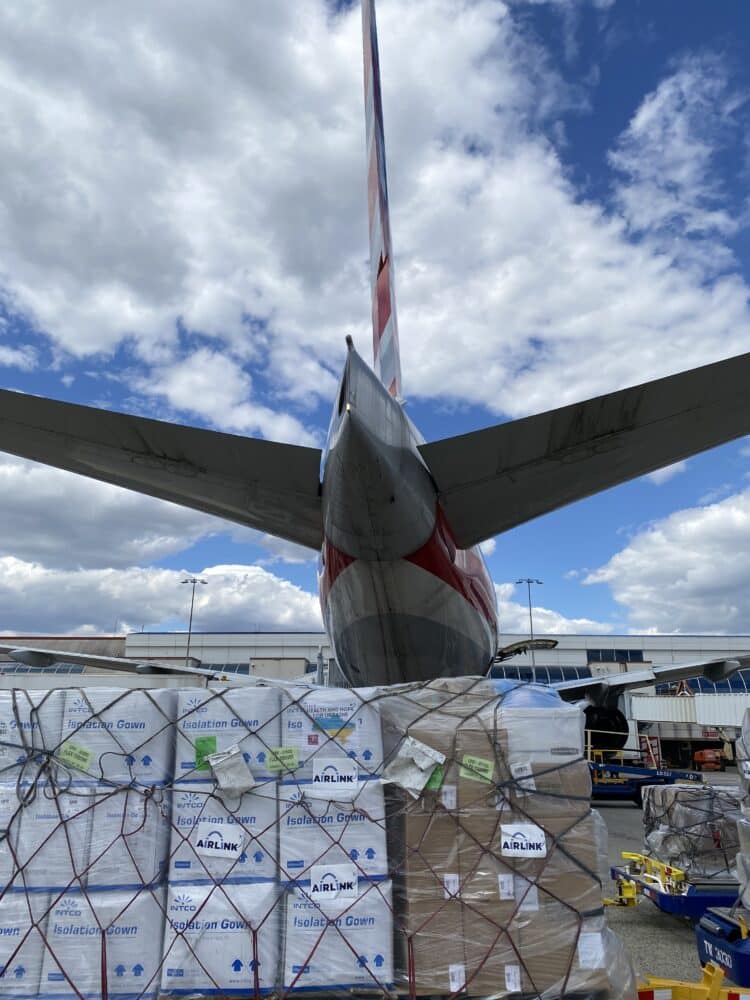 An airplane waits to be loaded with aid
