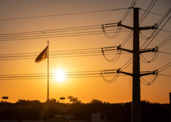 Power lines in Austin, Texas, US, on Friday, Sept. 8, 2023. Texas is in the midst of its worst power crisis since a deadly winter storm more than two years ago, with utilities urging customers to unplug electric vehicles and pool filters to conserve power. (Photographer: Sergio Flores/Bloomberg)