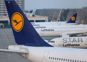 Lufthansa passenger jets sit on the tarmac at Frankfurt Airport