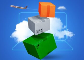 Three boxes with the colors of the Indian flag are stacked against a blue background with clouds in the outline of a laptop with a Qatar Airways Cargo plane flying away