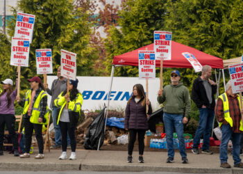 Workers picket outside a Boeing facility