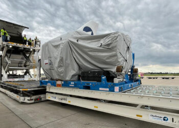 An engine is transported on a specialized dolly at Liege Airport