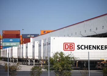 Containers are parked at a DB Schenker logistics hub in Grossbeeren, Germany